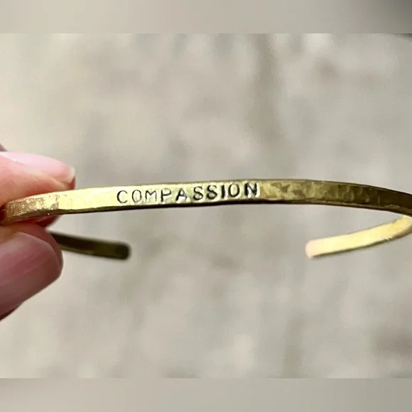 Brass bangle with “Compassion” stamped on it. Hammered finish. - Picture 2 of 5